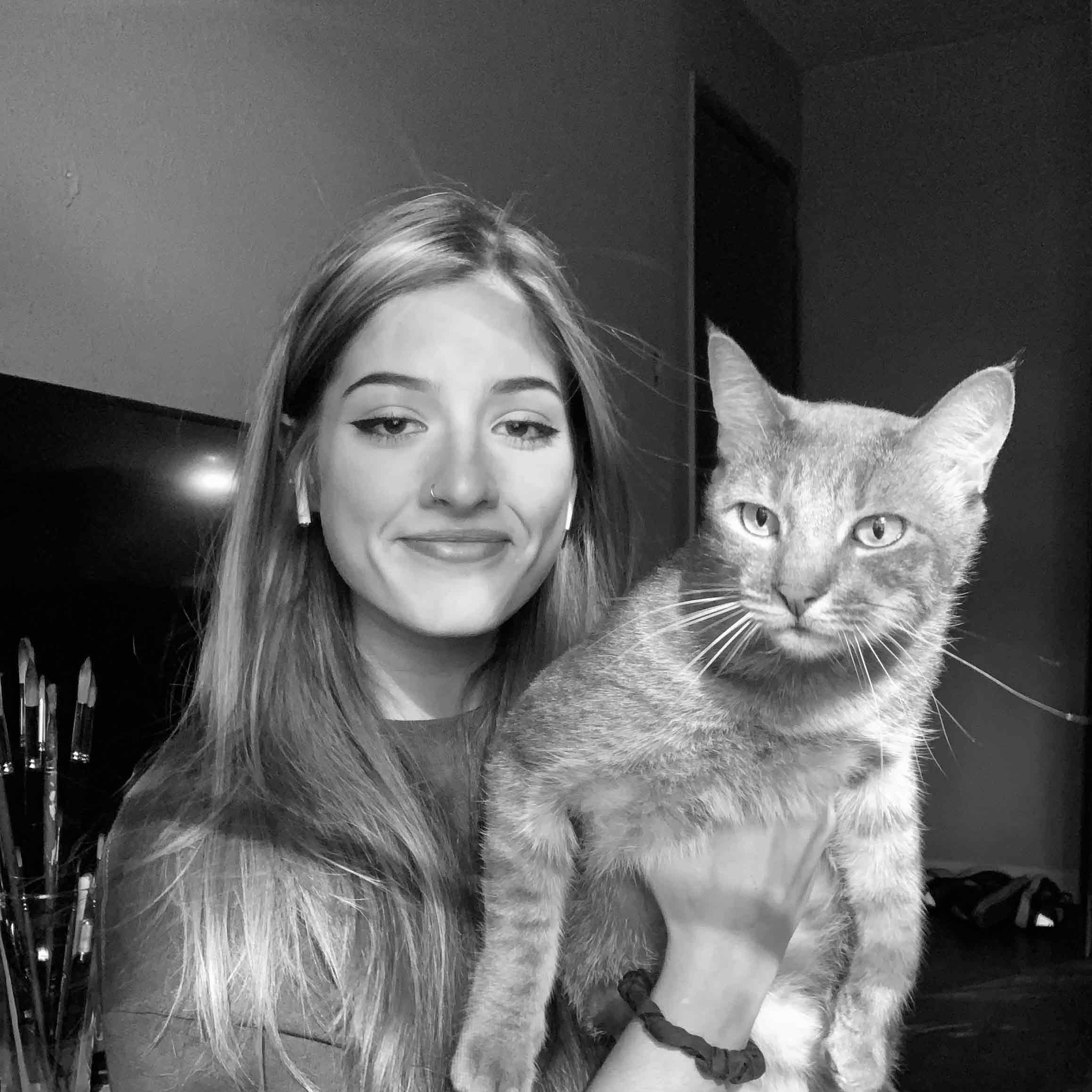 black and white photo of Aubrie holding her cat